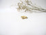 A gold solitaire diamond ring. Hand engraved with scrolls, leaves and flowers in Victorian Style