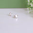 A silver 5 pointed star and a silver crescent moon highlighted with a tiny pearl makes a unique celestial pair of earrings!