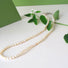 A hand strung genuine pearl necklace composed of small and delicate
white luminous oval freshwater pearls.