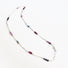 Authentic gemstones: Blue topaz, Garnets, Rhodolite garnets. Rubies  Sapphires and genuine pearls are arranged in an artful and asymmetrical design on a sterling silver paper clip link chain