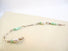 A silver link bracelet showcases light green coloured Peruvian Opal beads and genuine fresh water pearls.