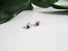 Silver post earrings with genuine red garnets stones and a pearl are nestled between the V leaf shaped design.P