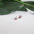 Silver post earrings with genuine red garnets stones and a pearl are nestled between the V leaf shaped design.P