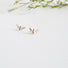 little silver bees with wings spread ready to fly to the next flower