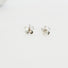 A five petal flower stud earring. Hand textured petals and silver balls in the centre of the fl
