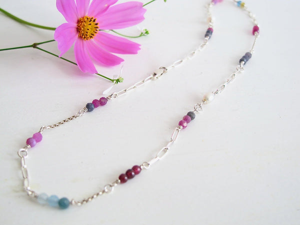 A  16 " Silver paper clip  link necklace studded with 3 mm genuine gemstones: beads of  Sapphires, Rhodolite Garnets, Apatite, Genuine Freshwater Cultured Pearls.
