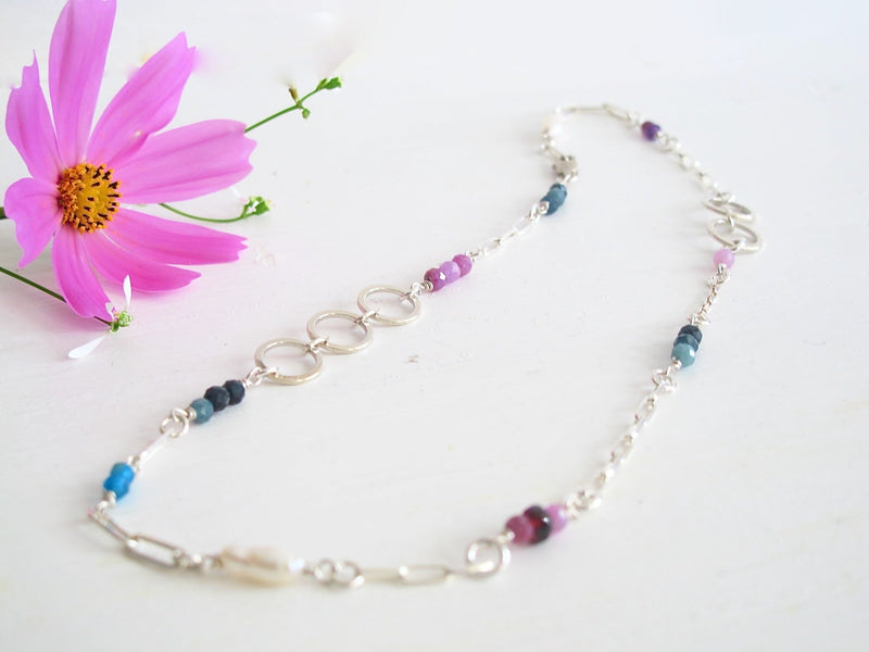 A  16 " Silver paper clip  link necklace studded with 3 mm genuine gemstones: beads of  Sapphires, Rhodolite Garnets, Apatite, Genuine Freshwater Cultured Pearls.
