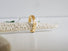 Hand carved gold band. The design is reminiscent of natural motifs like scrolls, leaves. 