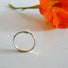 A slender ring showing a snake eating its gold tail in the tradition of the symbol of eternal life. 