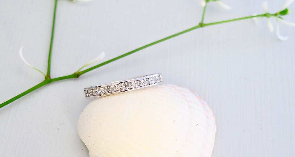A platinum Band with 1.5 mm round diamonds encircling the band.
