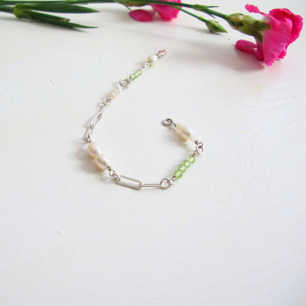 A Link bracelet composed of  silver Paperclip chain and 3 mm gemstone beads: Apple Green Peridot, White Pearls, White Moonstone. Length 7.50 " with lobster clasp/ 